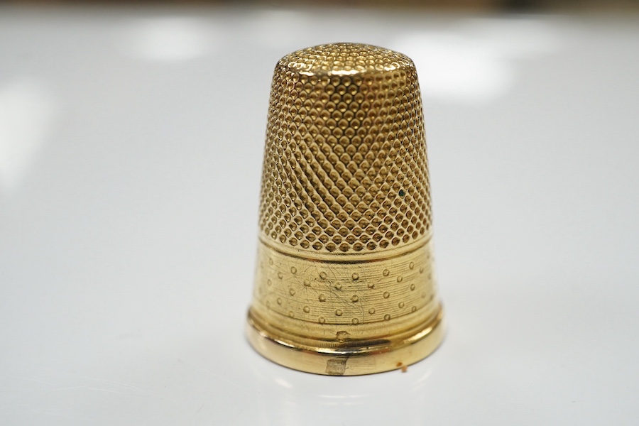 A cased French 18ct gold(eagles head mark) thimble, 4.3 grams. Condition - fair